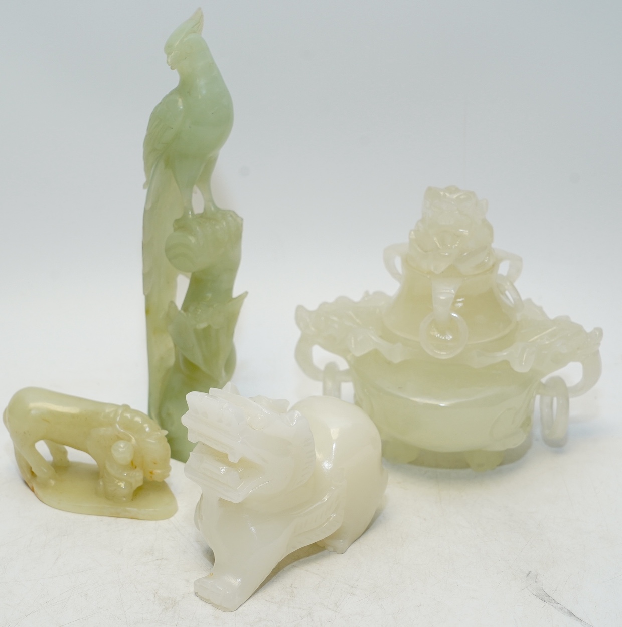 Four Chinese bowenite jade pieces including carving of a bird, largest 20cm. Condition - fair